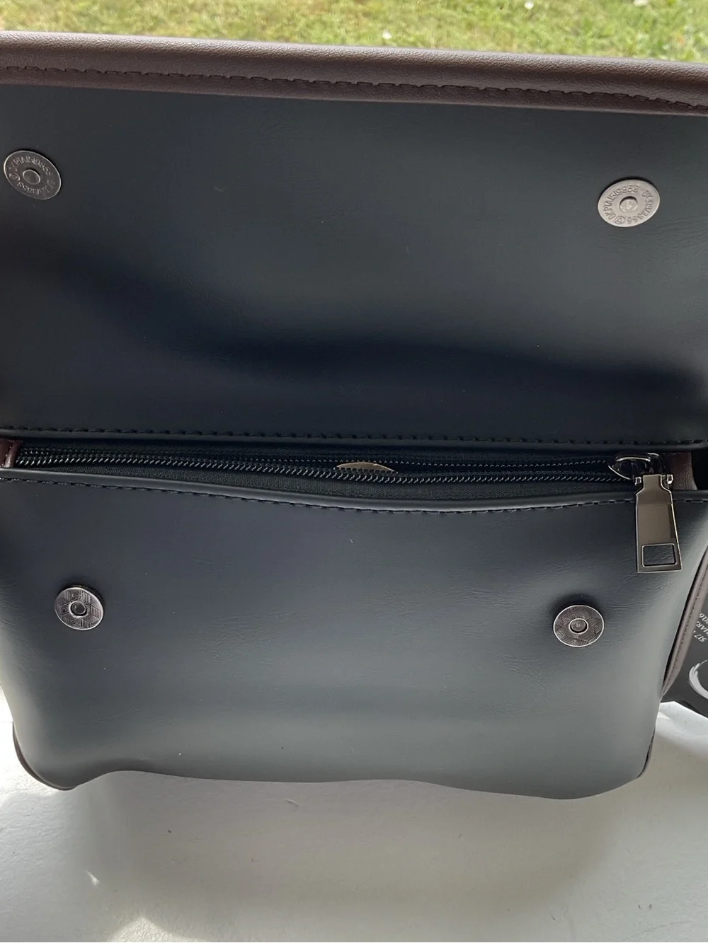 Black Crossbody Bag with Brown Trim and Adjustable Strap